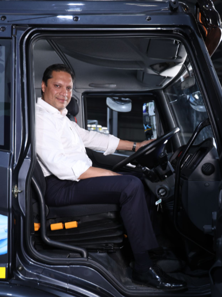 Anirudh Bhuwalka, founder of Blue Energy Motors, pictured inside an electric heavy-duty truck.